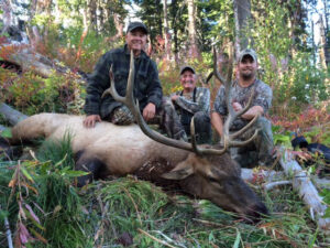 Happy Hunters with giant Rocky Mountain Bull Elk