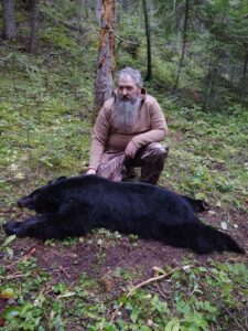 Hunter and his black bear