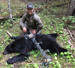 Youth with his Black Bear taken with Archery
