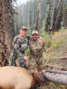 Happy hunters with Elk