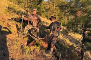 Nice size elk with 2 happy hunters - dad and son team