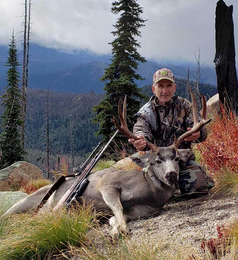 Hunter with his Mule Deer trophy