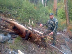Hunter with his Rocky Mountain Elk